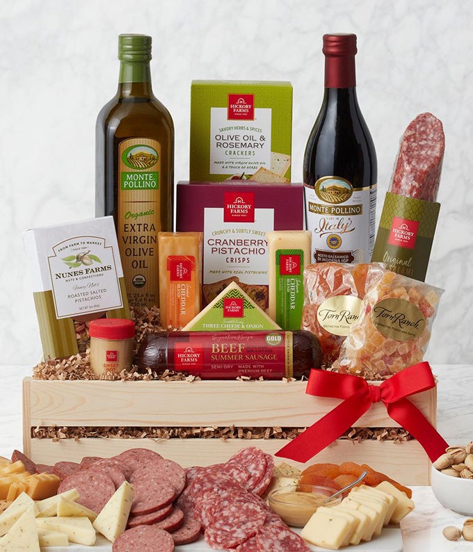 Wooden crate delivered with summer sausage, cheese, dried fruit, olive oil, nuts and more gourmet gifts