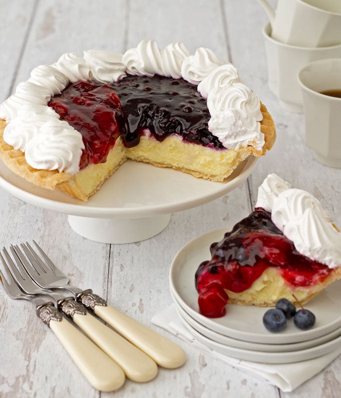 Berry Cheesecake Pie topped with blueberries and cherries delivered