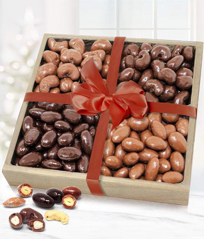 chocolate covered nuts in a wooden tray