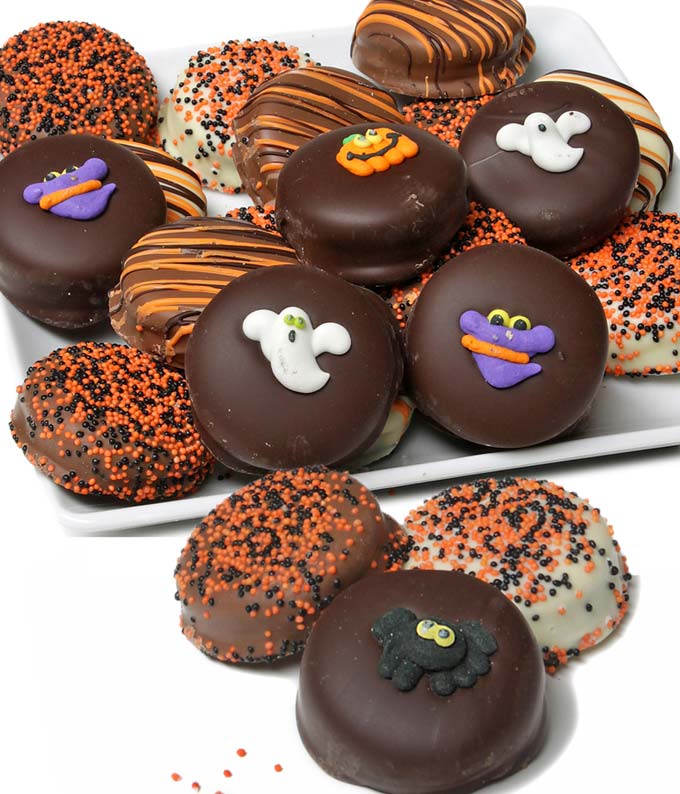 Halloween chocolate covered cookies with pumpkin and ghost decorations