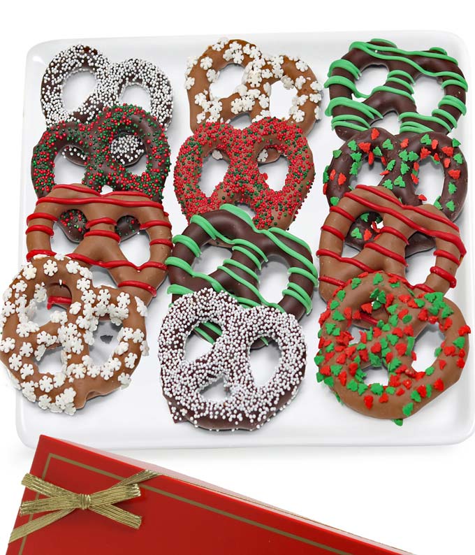 Christmas pretzels dipped in chocolate and topped with sprinkles