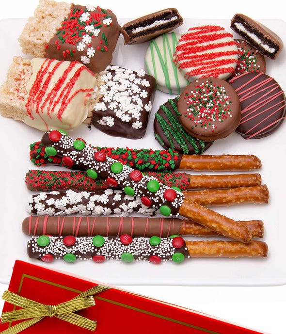 Christmas chocolate covered oreos, pretzels and rice krispie treats. 